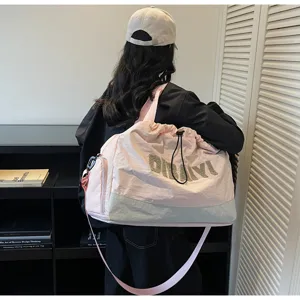 Stylish travel duffel bag for women, pink and blue colorblock commuter shoulder bag lightweight.