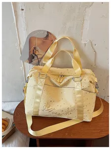 Fashionable starry travel duffel bag for women, commuter shoulder bag with star print.