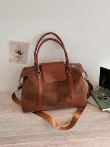 Canvas travel duffel bag for women, large capacity weekender bag with shoulder strap.