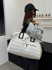 Large capacity quilted white tote travel bag, lightweight puffer shoulder duffel for gym.