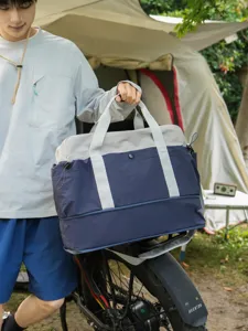 Color-blocked travel duffle bag, stylish shoulder outdoor camping storage bag for luggage.