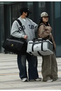 Large capacity waterproof travel duffel bag with shoulder straps, stylish sportswear.