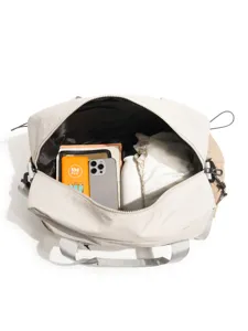 Colorblock travel duffel bag with large capacity, ideal for short trips and camping gear.