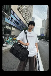 Multifunctional black travel duffel bag for men and women, perfect for gym, sports and outdoor.