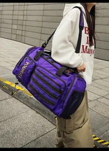 Purple tactical gym duffel bag with multiple pockets and durable shoulder strap for travel.