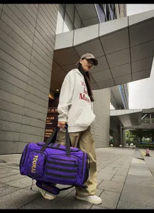 Purple travel duffel bag with multiple pockets and shoulder strap for fitness and sports outdoor use.