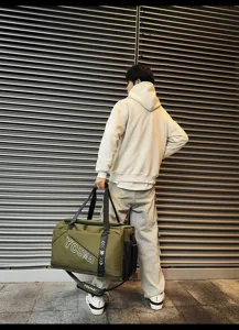 Large capacity travel duffel bag for sports and fitness, top-open design with shoulder strap.