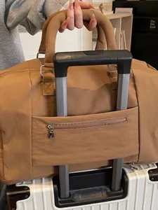 Travel duffel bag with trolley sleeve, large capacity weekender bag for sports gym business.
