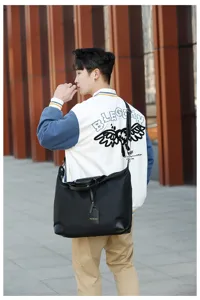 Large capacity black waterproof travel bag with shoulder strap and handle for casual sports.