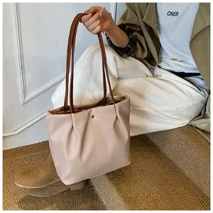 Simple solid color shoulder bag for women daily commute stylish minimalist handbag shopping tote.