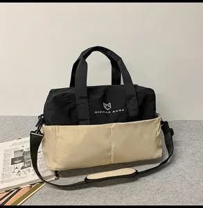 Black and khaki travel duffel bag with double handles and shoulder strap for fitness gym sports.