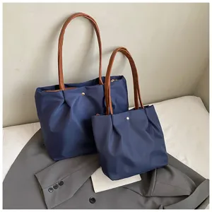 Solid color shoulder travel bag, simple fashion commuter handbag, elegant daily use tote bag.
