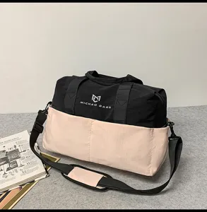 Stylish black and pink travel duffel bag with shoulder strap, durable gym sports bag for outdoor.