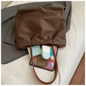 Minimalist solid color brown shoulder tote bag, stylish everyday commute and travel handbag.