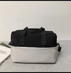 Detailed view of black and grey travel duffel bag durable outdoor fitness gym handbag.