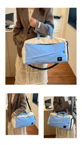 Color-block travel duffel bag with shoulder strap, blue and beige canvas, ideal for gym or trips.