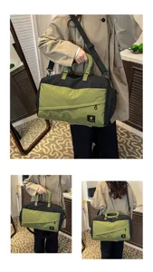 Green and black colorblock travel duffel bag, versatile shoulder crossbody bag for daily commute.