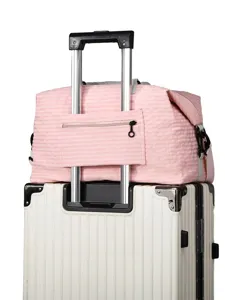 Pink plaid travel duffel bag with trolley sleeve, perfect for short trips and business commute.