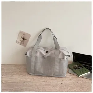 Large capacity grey travel duffel bag detail view, fashion casual style for gym or business trips.