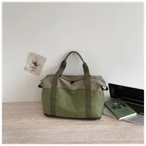 Large capacity travel duffel bag for gym, outdoor, and business trips with stylish green design.