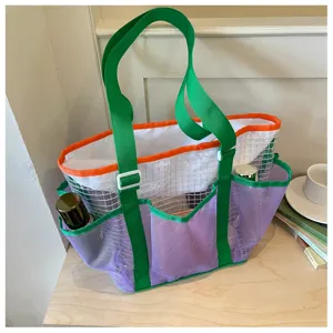 Creative mesh travel storage bag, breathable portable single shoulder tote for beach and sports.