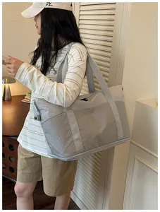 Expandable travel duffel bag with large capacity, casual grey shoulder bag for fitness and trips.