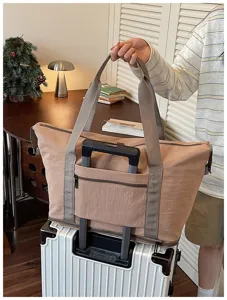 Large capacity travel duffel bag with luggage sleeve, ideal for weekend trips and gym.