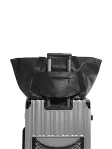 Black travel duffel bag with trolley sleeve and secure zipper pocket for weekend trips