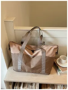Large capacity travel duffel bag for women, stylish tote bag for weekend trips and fitness.