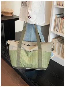 Large expandable travel duffel bag for gym, sports, and outdoor adventures with sturdy handles.