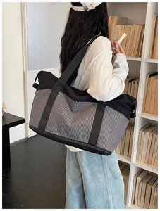 Large capacity travel duffel bag with stylish grid pattern for outdoor sports and daily trips.