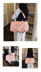 Large capacity pink star pattern travel duffel bag with shoulder strap and shoe compartment.