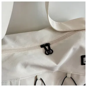 Detailed view of the large capacity travel duffel bag zipper and adjustable strap design.