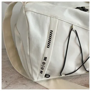 Detailed view of the large capacity sports duffel bag side with stylish print and strap.
