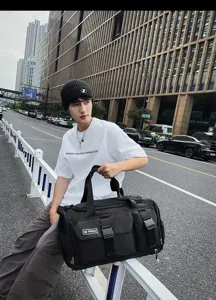 Black large capacity travel duffel bag for gym sports and outdoor fitness use easily.