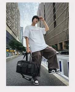 Black large capacity travel duffel bag for gym, fitness, and outdoor sports storage use.