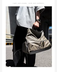 Detailed view of the multi-functional travel shoulder bag showing durable fabric and zipper.