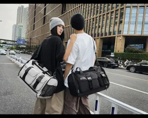 Large capacity duffel bag for travel, gym, and sports, stylish shoulder bag for men and women.