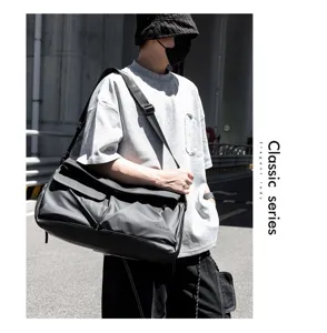 Detailed view of the multi-functional large capacity travel shoulder bag in dark grey.