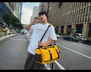 Stylish yellow travel duffel bag with multiple pockets, durable straps for gym sports outdoor use.
