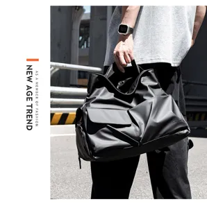Black travel duffel bag detail showcasing waterproof fabric and large capacity.