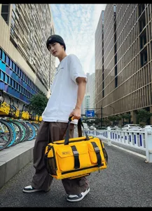 Yellow travel duffel bag for men and women, waterproof sports gym bag and fitness storage bag.