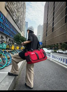 Large capacity travel duffel bag for men and women, multi-pocket red sports fitness luggage.
