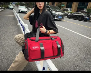 Large capacity red travel duffel bag with multi pockets and straps for fitness and sports.