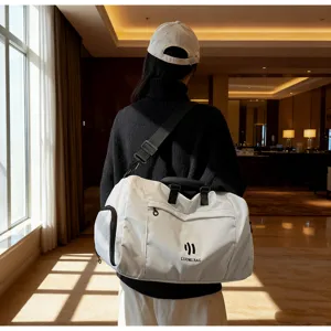 Large capacity solid color travel duffel bag detail view, lightweight sports fitness luggage storage pack.