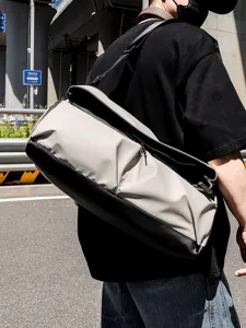 Stylish multi-functional large capacity travel shoulder bag, commuter messenger bag for daily use.