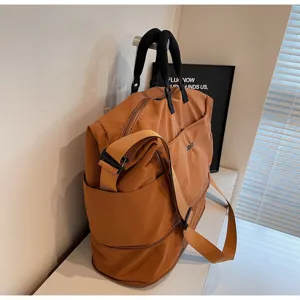 Large capacity travel duffel bag for women and men, casual fitness shoulder bag with strap.