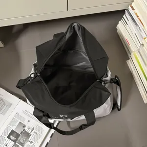 Detailed view of the open black and grey travel duffel bag showing spacious interior.