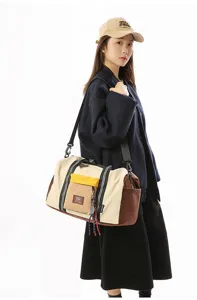 Large capacity travel duffel bag for women, stylish color block gym shoulder bag for fitness.