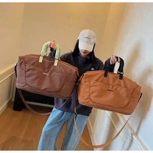 Large capacity travel duffel bag for women and men, lightweight gym sports bag with shoulder strap.